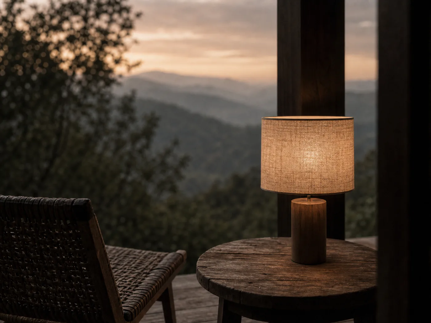 A single lamp lit on the terrace as the last daylight goes.